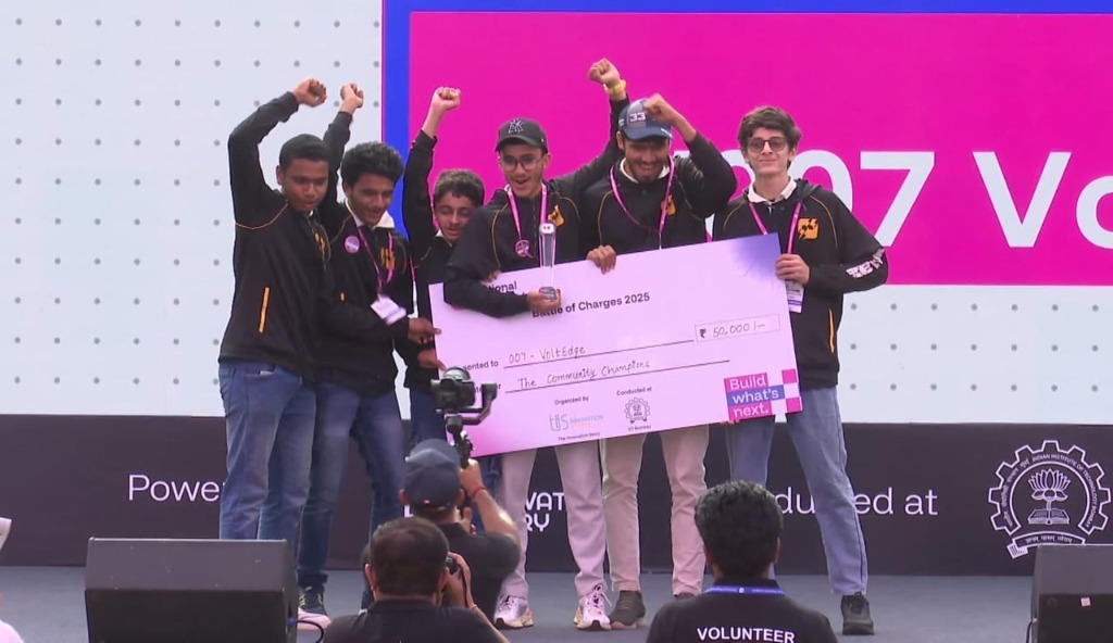 Team VoltEdge celebrating on stage at IIT Bombay after being awarded the Community Champions title
